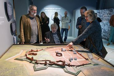 Archaeologists discussing the exhibition.